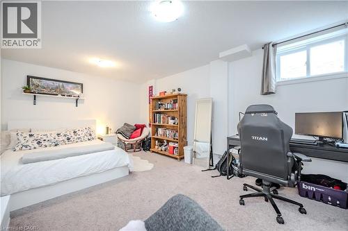 Bedroom with light carpet and an office area - 23 Kingsbury Square Unit# 23, Guelph, ON - Indoor