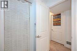 Hall featuring light colored carpet - 