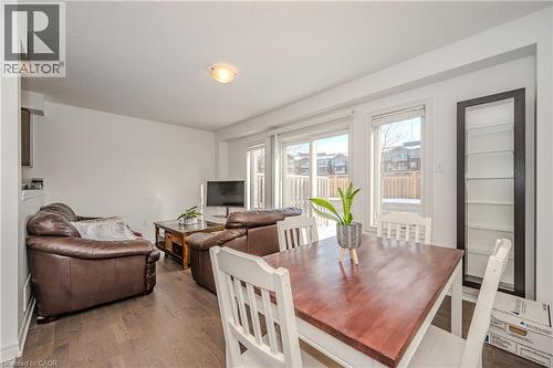Dining area with dark wood-style floors - 23 Kingsbury Square Unit# 23, Guelph, ON - Indoor Photo Showing Other Room