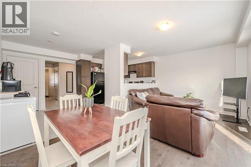 Dining area featuring light wood-style flooring - 23 Kingsbury Square Unit# 23, Guelph, ON - Indoor