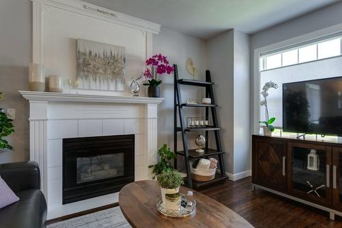 1114-2440 Old Okanagan Highway, West Kelowna, BC - Indoor Photo Showing Living Room With Fireplace