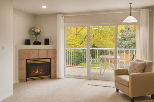 204-1240 Verdier Ave, Central Saanich, BC - Indoor Photo Showing Living Room With Fireplace
