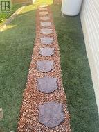 Synthetic turf with walkway side door to backyard - 