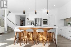 Modern White Kitchen w/White Quartz Counters - 