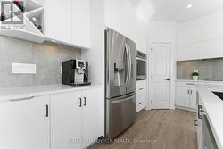 Modern grey backsplash & Walk In Pantry - 
