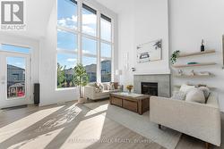 Great Room w/2 Storey Ceilings & Gas Fireplace - 