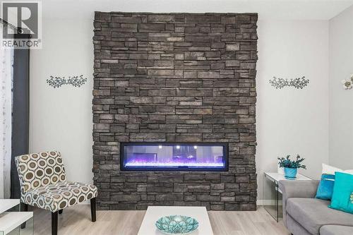 43 Seton Rise Se, Calgary, AB - Indoor Photo Showing Living Room With Fireplace