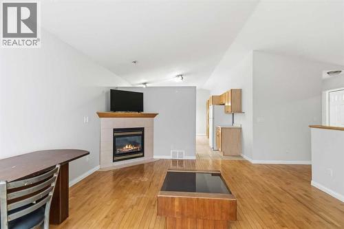 213 Diefenbaker Drive, Fort Mcmurray, AB - Indoor Photo Showing Living Room With Fireplace