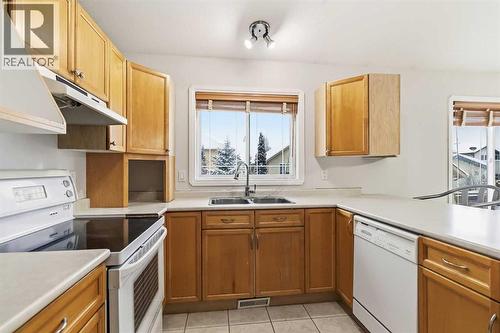 213 Diefenbaker Drive, Fort Mcmurray, AB - Indoor Photo Showing Kitchen With Double Sink