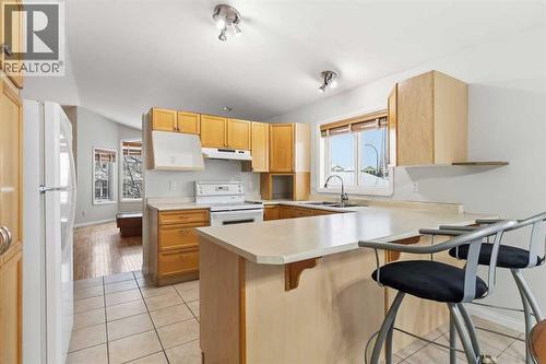 213 Diefenbaker Drive, Fort Mcmurray, AB - Indoor Photo Showing Kitchen With Double Sink