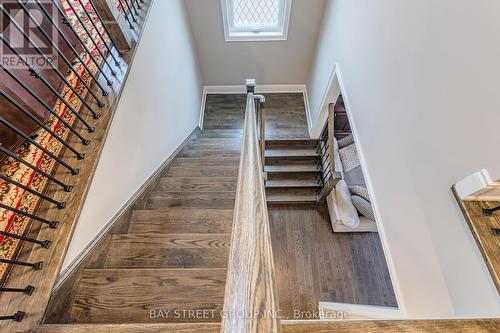 Oak Staircase With Iron Pickets - 39 Cairns Gate, King, ON - Indoor Photo Showing Other Room