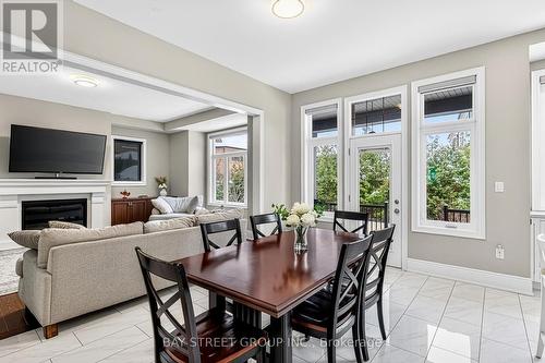 Breakfast Room Combined w/Family and Kitchen - 39 Cairns Gate, King, ON - Indoor With Fireplace