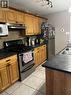 2, 1701 St Edward Boulevard N, Lethbridge, AB  - Indoor Photo Showing Kitchen With Double Sink 
