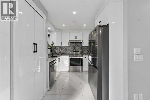 49 Taravista Way Ne, Calgary, AB - Indoor Photo Showing Kitchen With Upgraded Kitchen