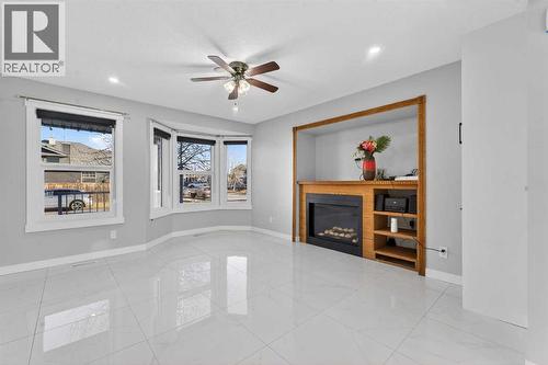 49 Taravista Way Ne, Calgary, AB - Indoor With Fireplace