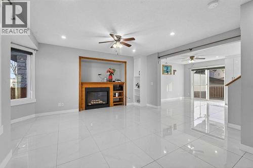 49 Taravista Way Ne, Calgary, AB - Indoor With Fireplace