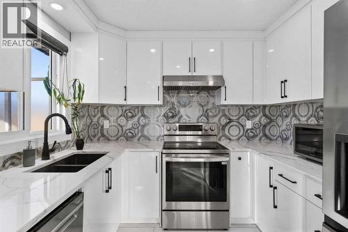 49 Taravista Way Ne, Calgary, AB - Indoor Photo Showing Kitchen With Double Sink With Upgraded Kitchen