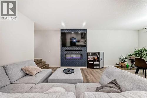 54 Seton Manor Se, Calgary, AB - Indoor Photo Showing Living Room With Fireplace