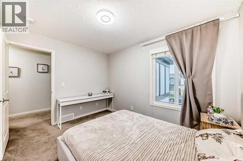 54 Seton Manor Se, Calgary, AB - Indoor Photo Showing Bedroom