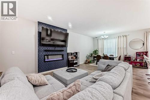 54 Seton Manor Se, Calgary, AB - Indoor Photo Showing Living Room With Fireplace