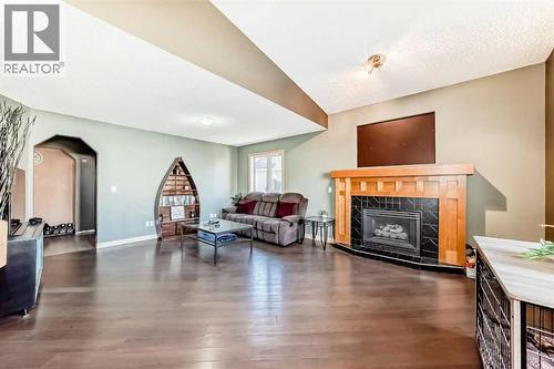 52 Douglas Ridge Close Se, Calgary, AB - Indoor Photo Showing Living Room With Fireplace