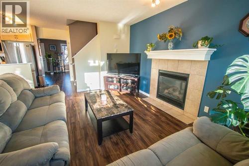 11 Saddlebrook Mews Ne, Calgary, AB - Indoor Photo Showing Living Room With Fireplace
