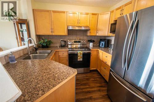 11 Saddlebrook Mews Ne, Calgary, AB - Indoor Photo Showing Kitchen With Stainless Steel Kitchen With Double Sink
