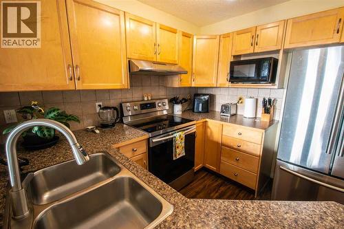 11 Saddlebrook Mews Ne, Calgary, AB - Indoor Photo Showing Kitchen With Double Sink
