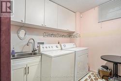 Laundry combined with 2-piece bathroom - 