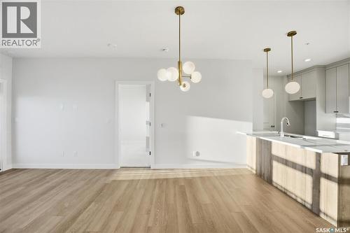 1303 101 Secord Way, Saskatoon, SK - Indoor Photo Showing Kitchen With Double Sink