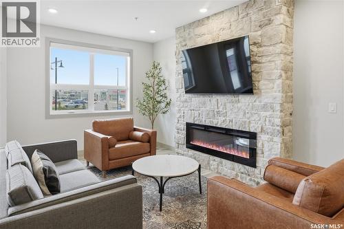 1304 101 Secord Way, Saskatoon, SK - Indoor Photo Showing Living Room With Fireplace