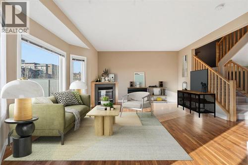 33 Prominence Park Sw, Calgary, AB - Indoor Photo Showing Living Room With Fireplace