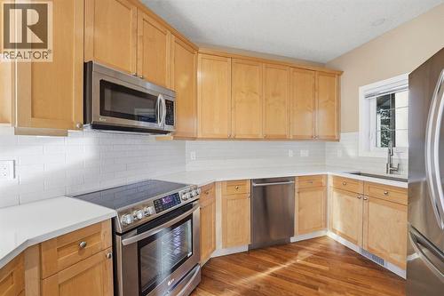 33 Prominence Park Sw, Calgary, AB - Indoor Photo Showing Kitchen With Stainless Steel Kitchen