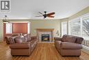 25 Westfall Drive, Okotoks, AB  - Indoor Photo Showing Living Room With Fireplace 