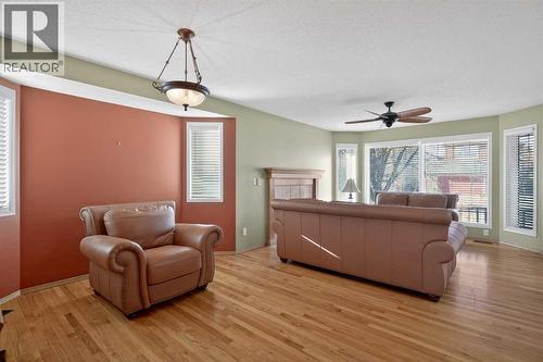 25 Westfall Drive, Okotoks, AB - Indoor Photo Showing Living Room