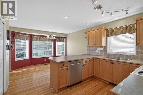 25 Westfall Drive, Okotoks, AB - Indoor Photo Showing Kitchen With Double Sink