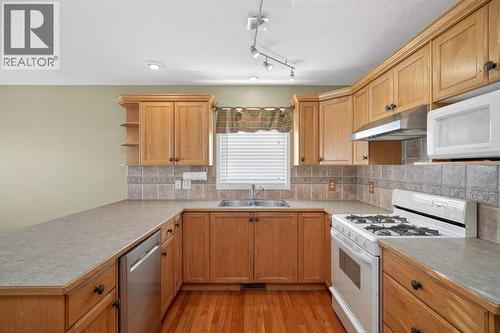 25 Westfall Drive, Okotoks, AB - Indoor Photo Showing Kitchen With Double Sink