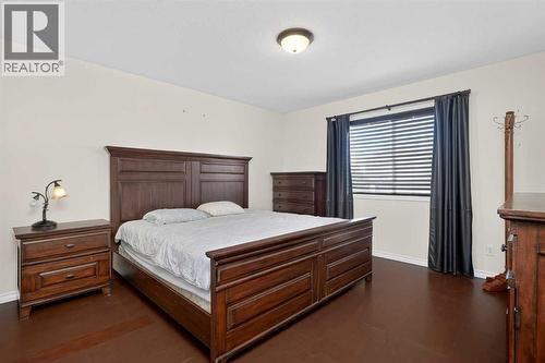 25 Westfall Drive, Okotoks, AB - Indoor Photo Showing Bedroom