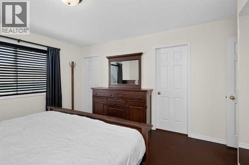 25 Westfall Drive, Okotoks, AB - Indoor Photo Showing Bedroom