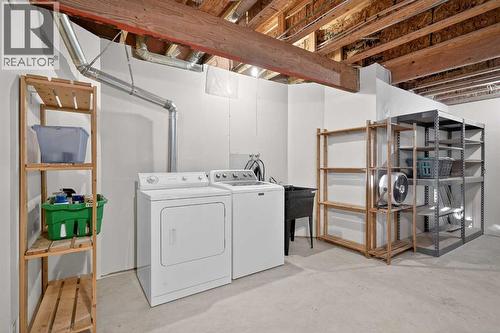 25 Westfall Drive, Okotoks, AB - Indoor Photo Showing Laundry Room