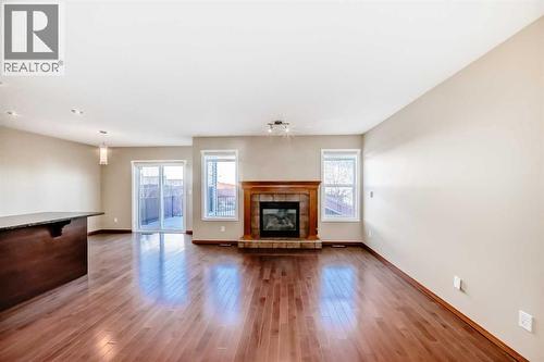 38 Springborough Way Sw, Calgary, AB - Indoor Photo Showing Living Room With Fireplace