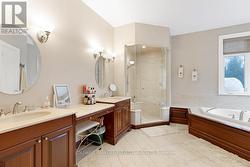 Primary suite's ensuite has two separate vanities - 