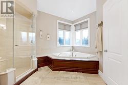 Ensuite soaker tub and glass shower - 