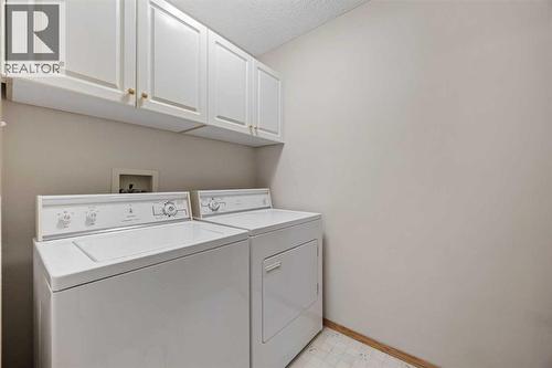 Laundry - 220 Sunset Place, Okotoks, AB - Indoor Photo Showing Laundry Room