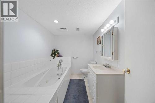 Basement - Full Bathroom - 220 Sunset Place, Okotoks, AB - Indoor Photo Showing Bathroom