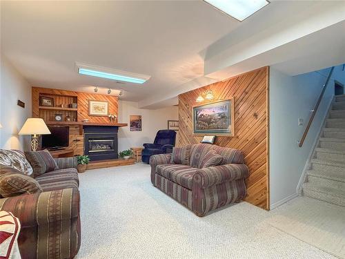 94 Clement Drive, Brandon, MB - Indoor Photo Showing Living Room With Fireplace