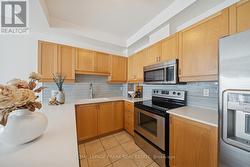 Updated Kitchen with Stone Countertops - 