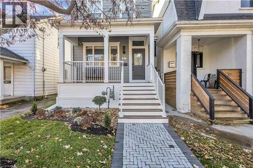 View of exterior entry with covered porch and roof with shingles - 37 Chatham Street, Hamilton, ON - Outdoor With Deck Patio Veranda With Facade