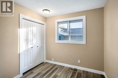 2nd bedroom located on the main floor with ample closet space - 467 Berkley Crescent Nw, Calgary, AB - Indoor Photo Showing Other Room