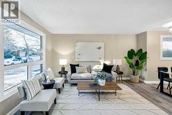 The living room is spacious and has a brand new window - 